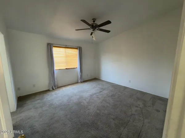 a bathroom with a sink toilet and mirror