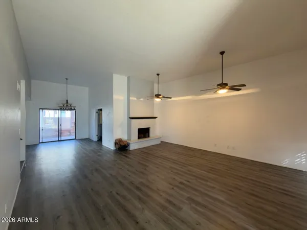 a view of a kitchen with a sink and dishwasher wooden floor