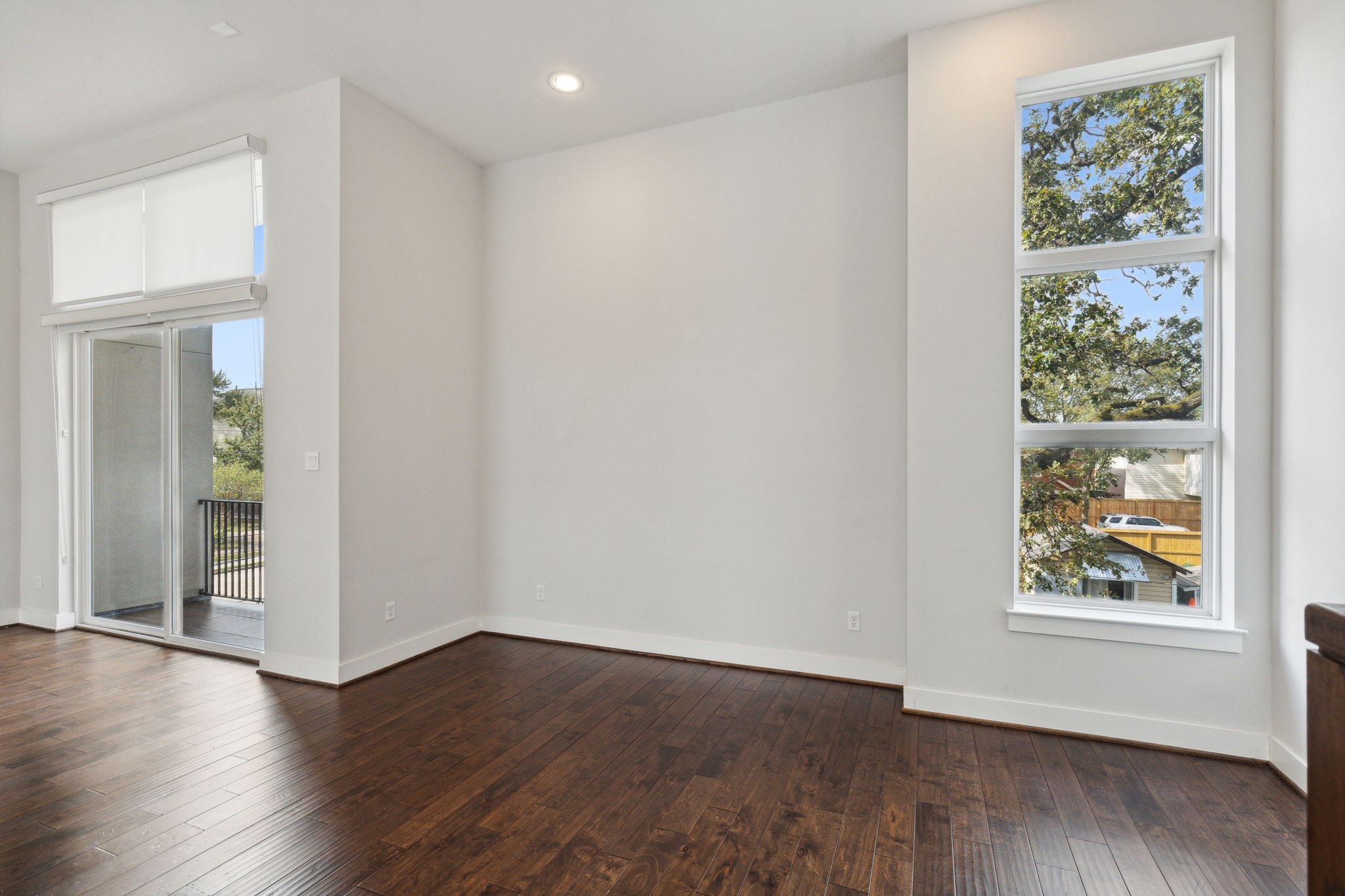 843 West 23rd Street, Unit B Houston, TX 77008 - Photo 11 of 34 an empty room with wooden floor and windows