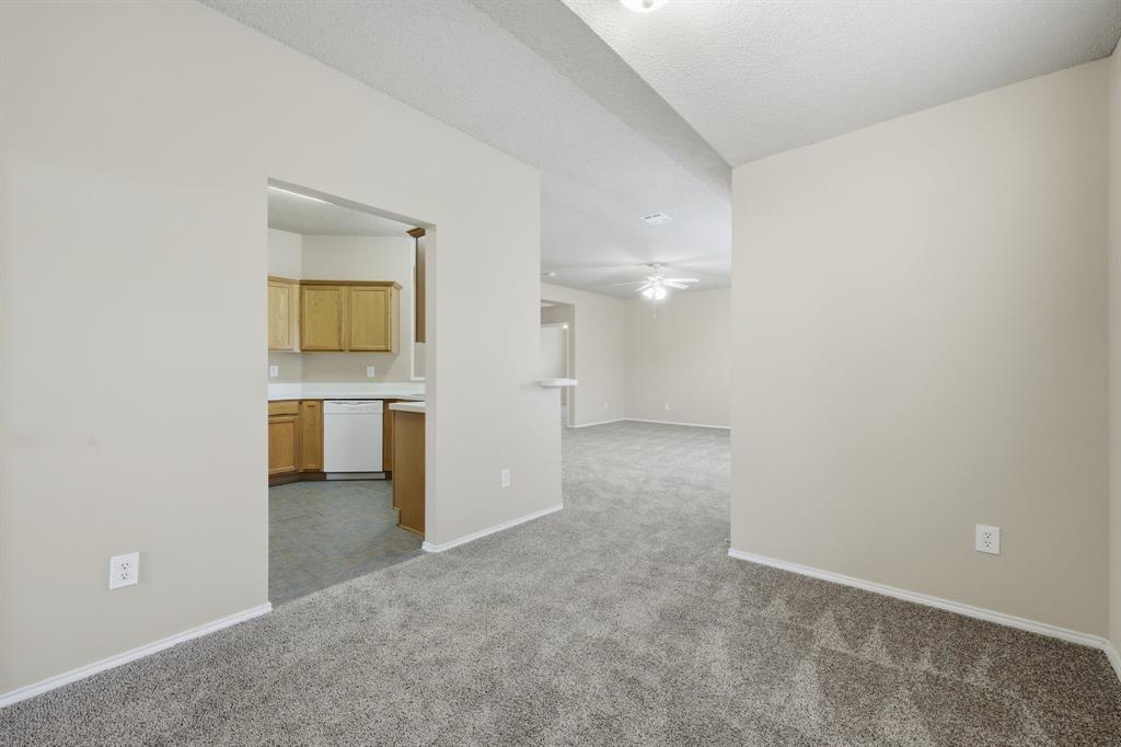 1410 Deville Circle Garland, TX 75043 - Photo 2 of 11 a view of a kitchen with a sink and a refrigerator
