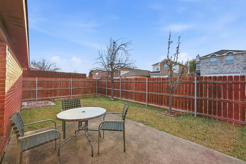 1410 Deville Circle Garland, TX 75043 - Photo 10 of 11 a view of a chairs and a table in the patio