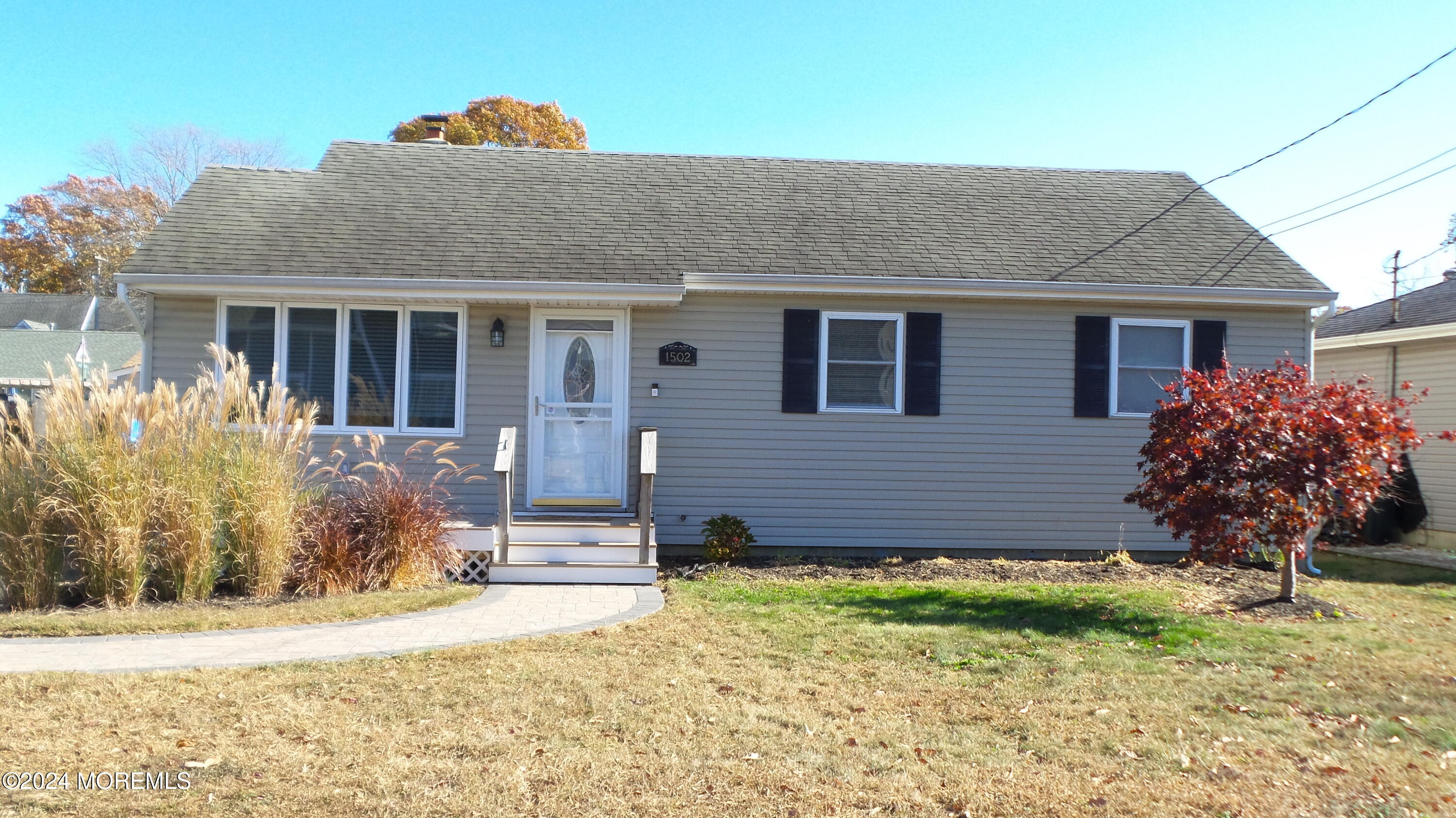 1502 Ivy Road Point Pleasant, NJ 08742 - Photo 3 of 24 a front view of house with yard and trees around
