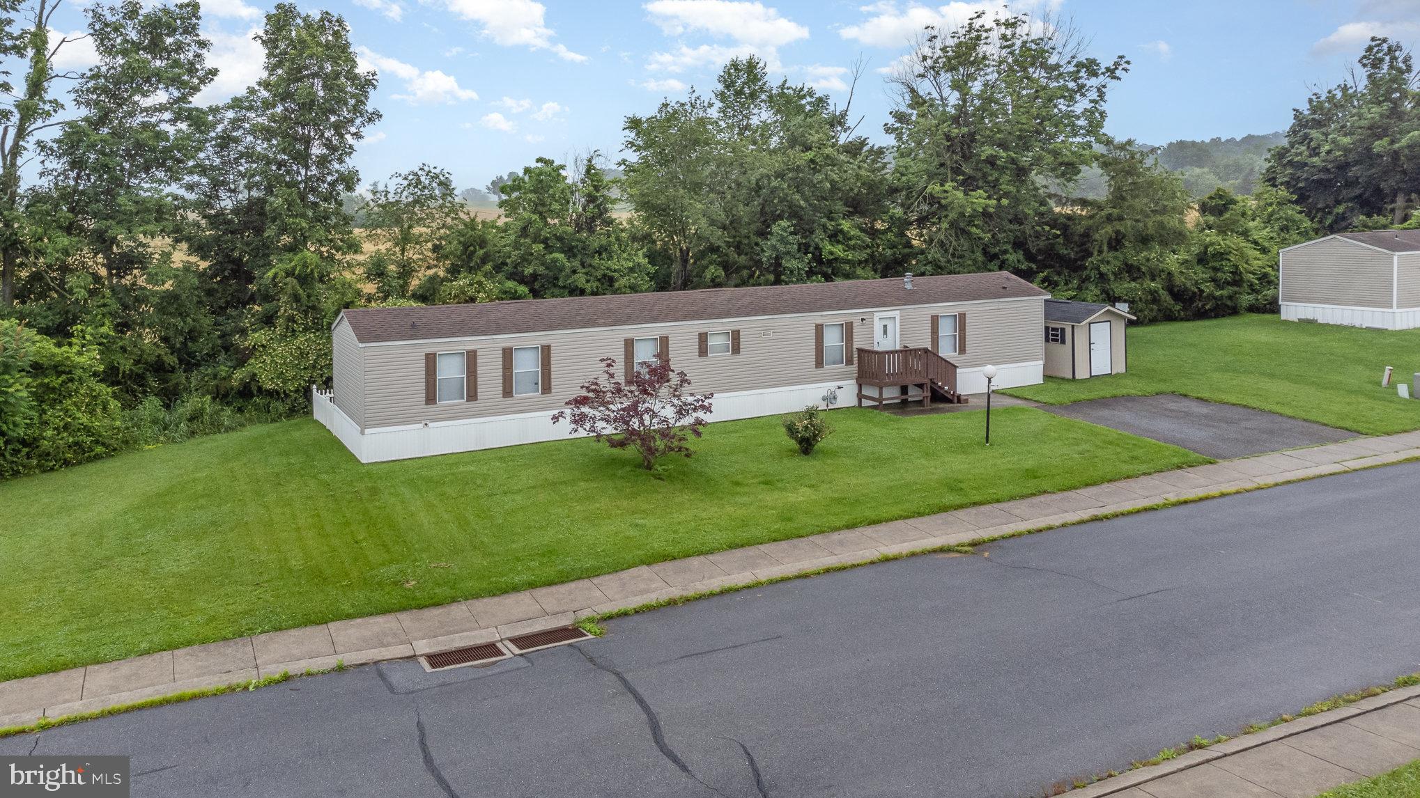 304 Ridge Road Elizabethtown, PA 17022 - Photo 4 of 37 a view of house with outdoor space and garden