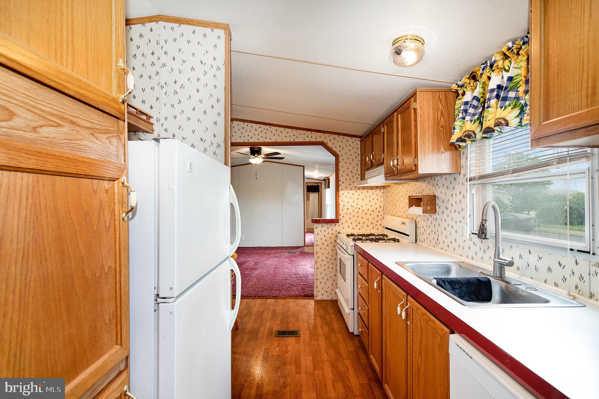 304 Ridge Road Elizabethtown, PA 17022 - Photo 8 of 37 a kitchen with stainless steel appliances a sink and a refrigerator