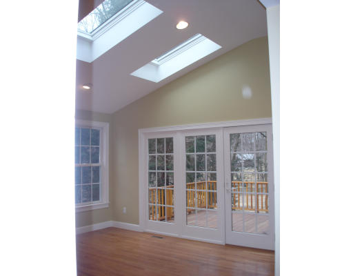 95 Reed Street Lexington, MA 02421 - Photo 4 of 8 a view of empty room with windows