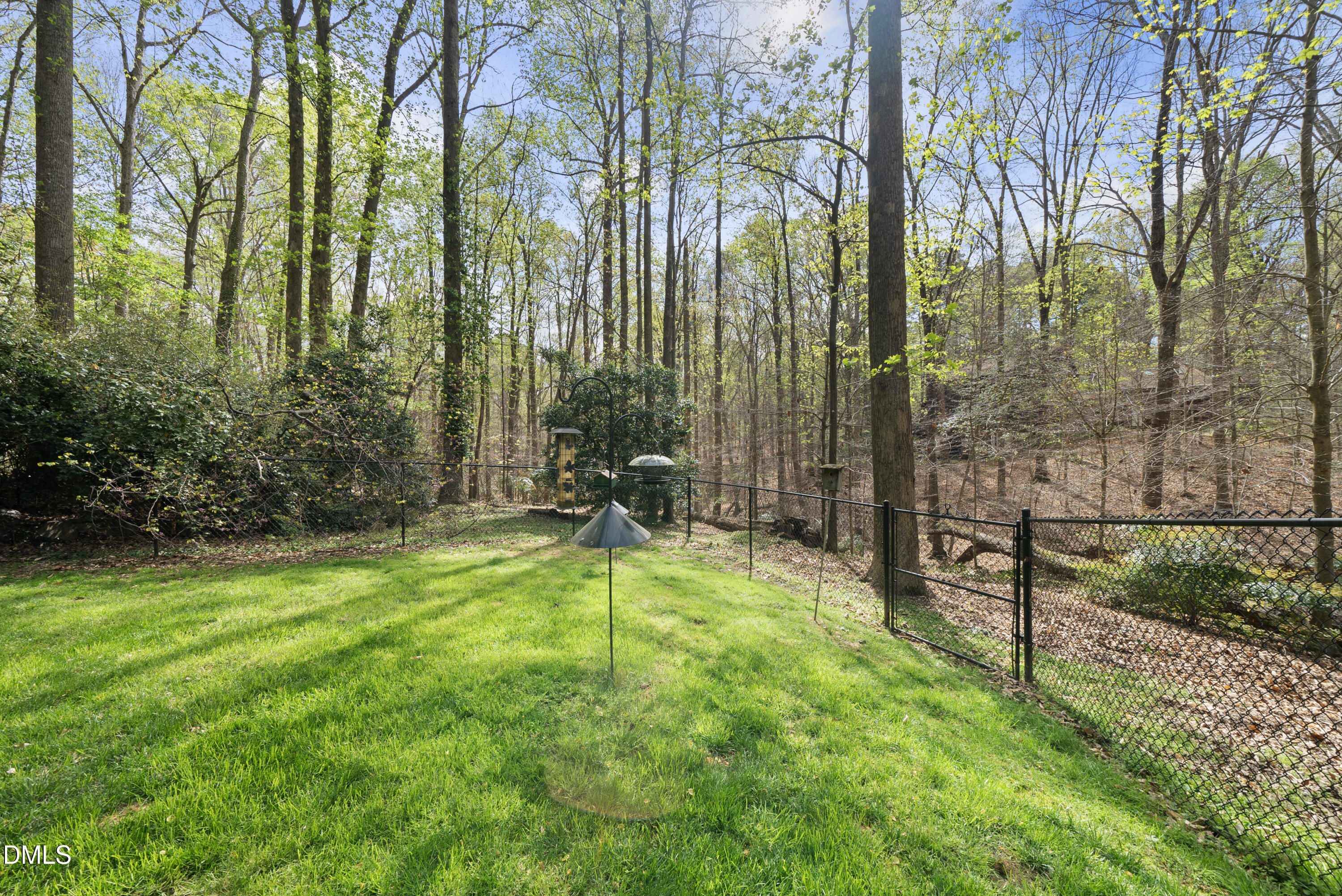 6200 Splitrock Trail Apex, NC 27539 - Photo 47 of 64 a swimming pool with lots of tress in front of it