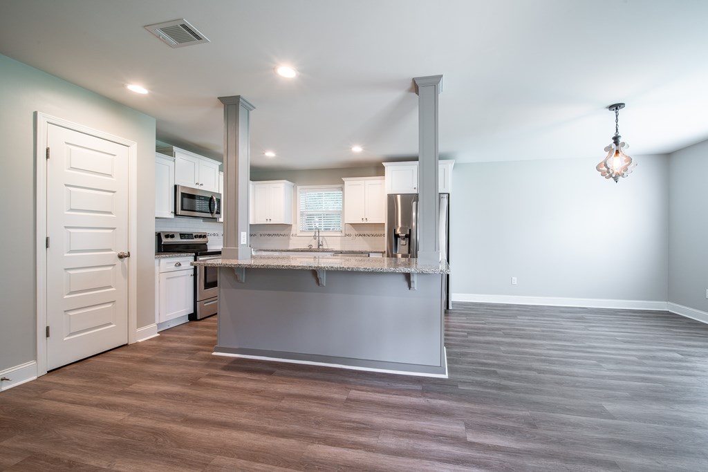 16 Maxwell Drive Fort Mitchell, AL 36856 - Photo 19 of 25 a view of a kitchen with wooden floor and electronic appliances