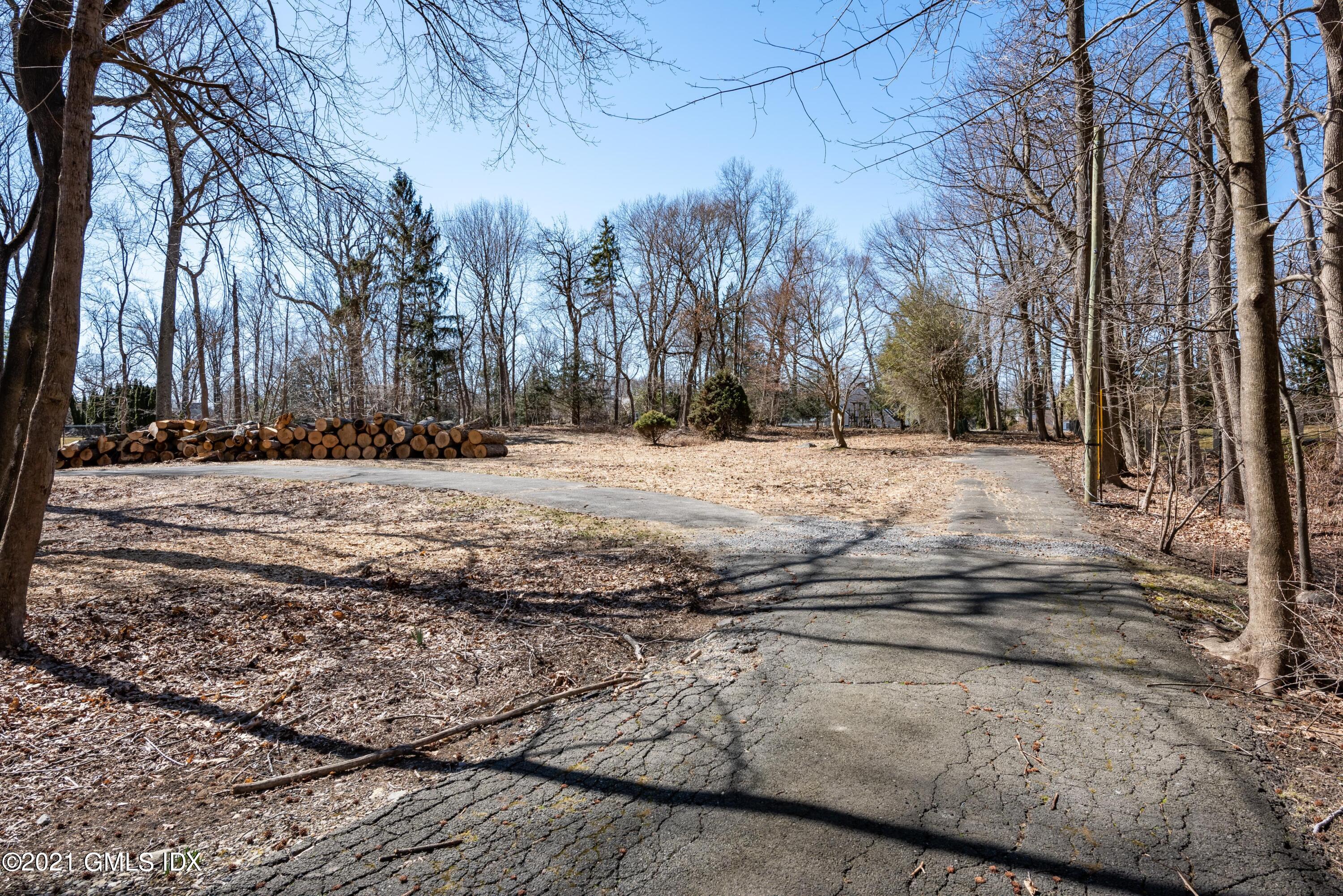 26 Red Top Road Riverside, CT 06878 - Photo 4 of 8 a view of a yard with trees