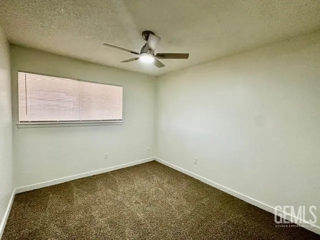 an empty room with a empty space and windows