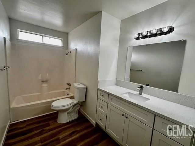 a bathroom with a sink and glass door