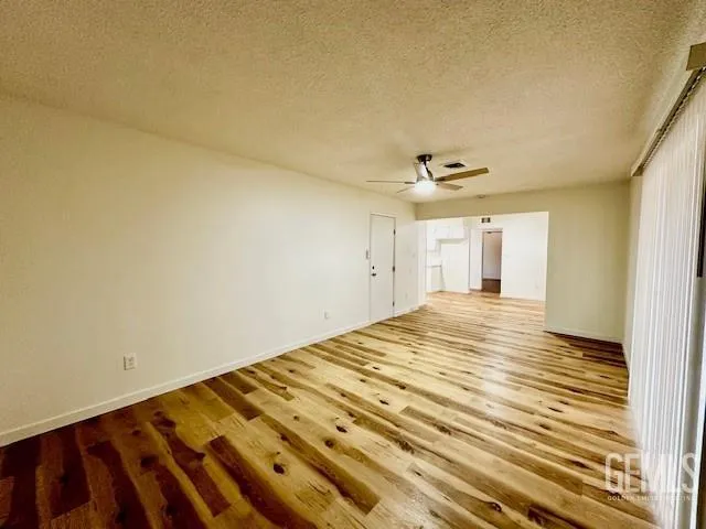 a kitchen with granite countertop a sink stainless steel appliances and cabinets