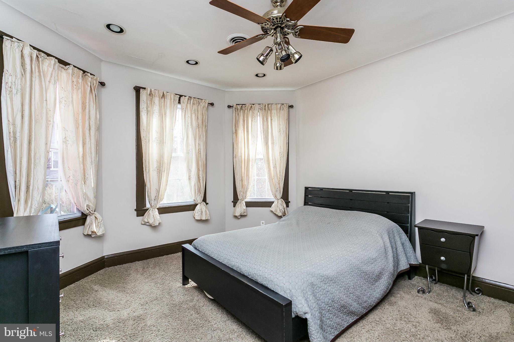 5620 Pimlico Road Baltimore, MD 21209 - Photo 16 of 30 Master bedroom, 3 large windows