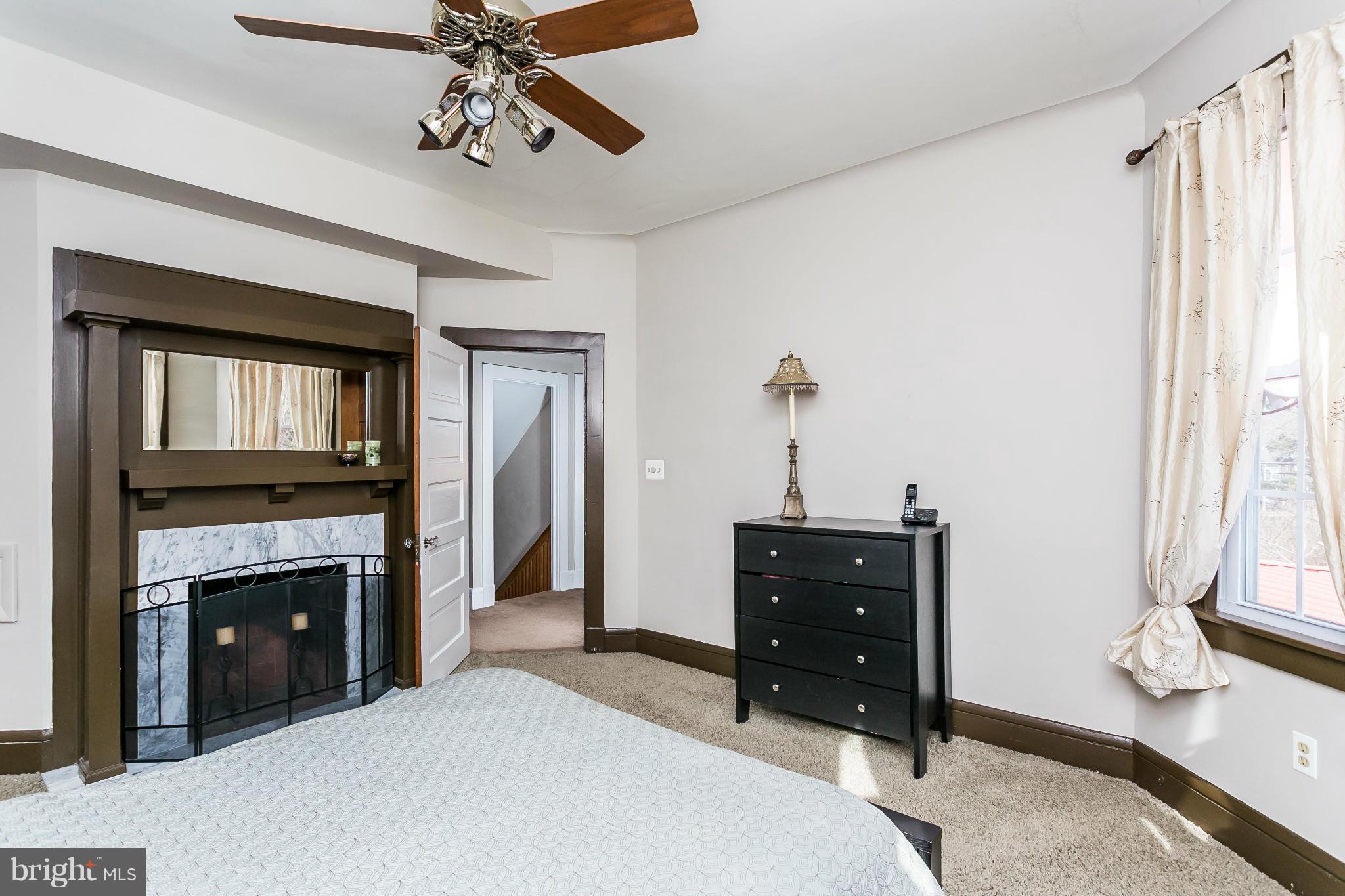 5620 Pimlico Road Baltimore, MD 21209 - Photo 17 of 30 Master bedroom with fireplace