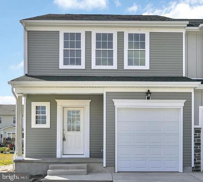 213 Tea Party Trail Dover, DE 19901 - Photo 1 of 1 a front view of a house with a garage