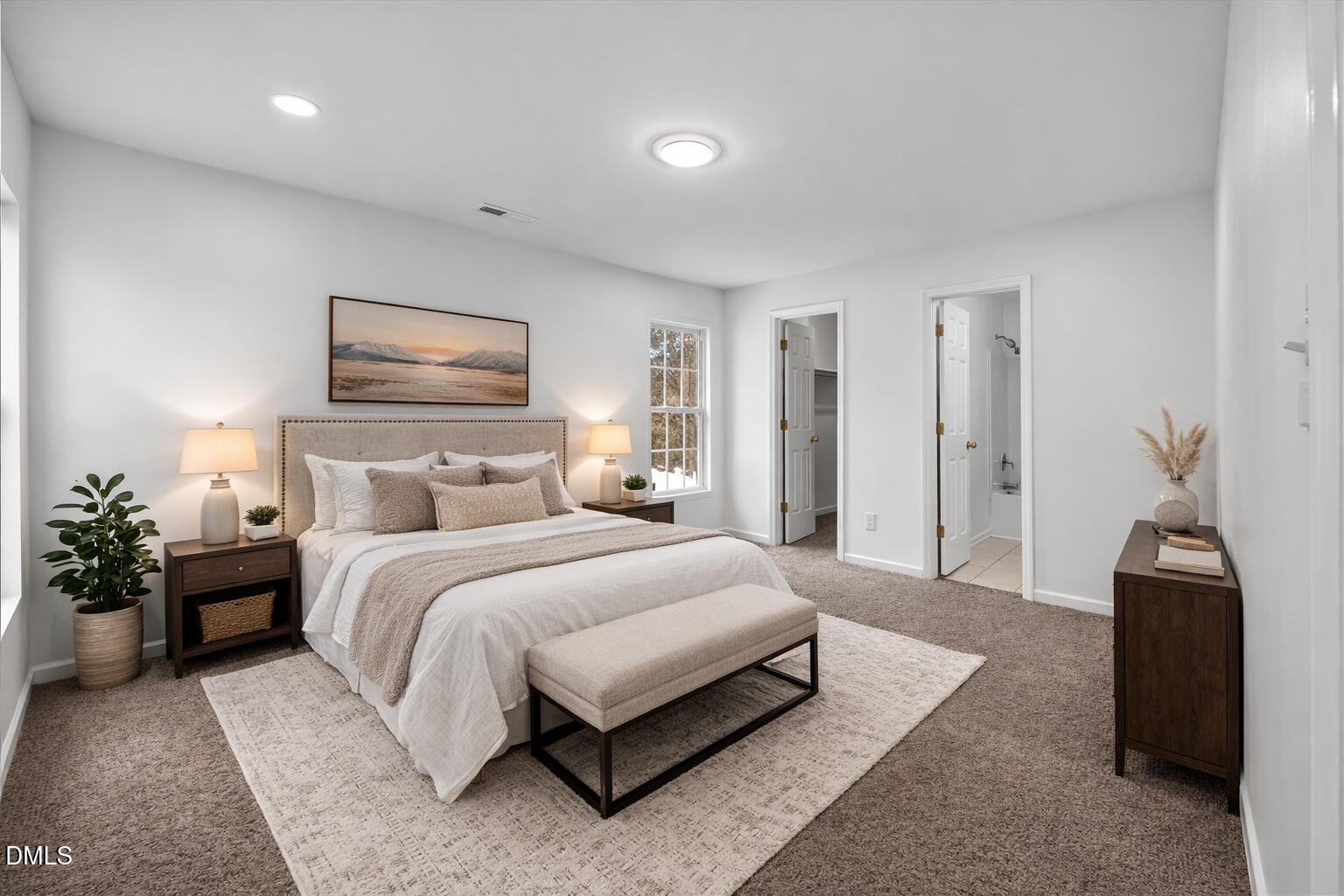 3831 Pin Oak Road Raleigh, NC 27604 - Photo 11 of 28 a spacious bedroom with a bed and a couch