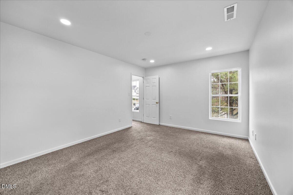 3831 Pin Oak Road Raleigh, NC 27604 - Photo 14 of 28 an empty room with windows