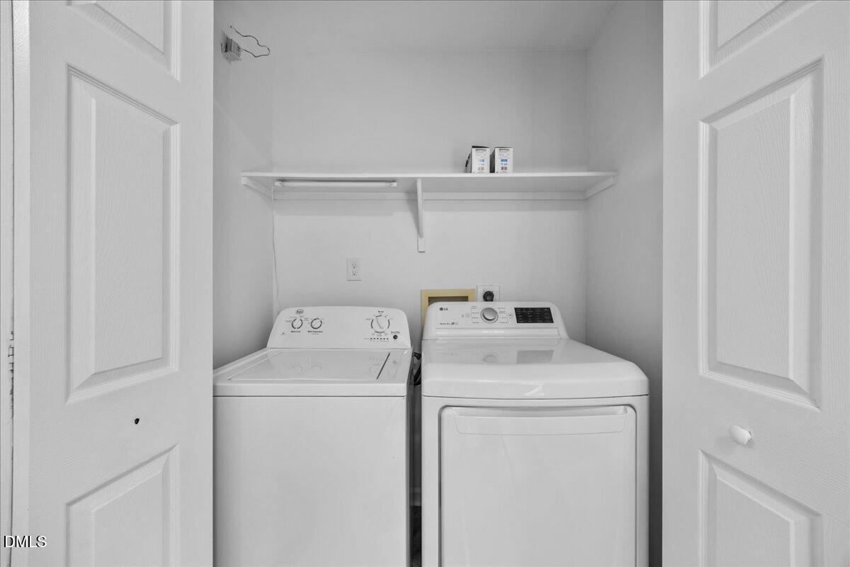 3831 Pin Oak Road Raleigh, NC 27604 - Photo 18 of 28 a utility room with dryer and washer