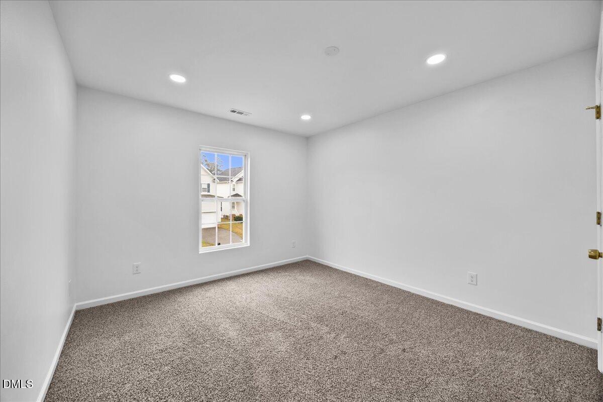 3831 Pin Oak Road Raleigh, NC 27604 - Photo 19 of 28 a view of an empty room with a window