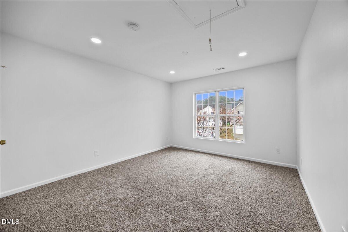 3831 Pin Oak Road Raleigh, NC 27604 - Photo 21 of 28 an empty room with a window