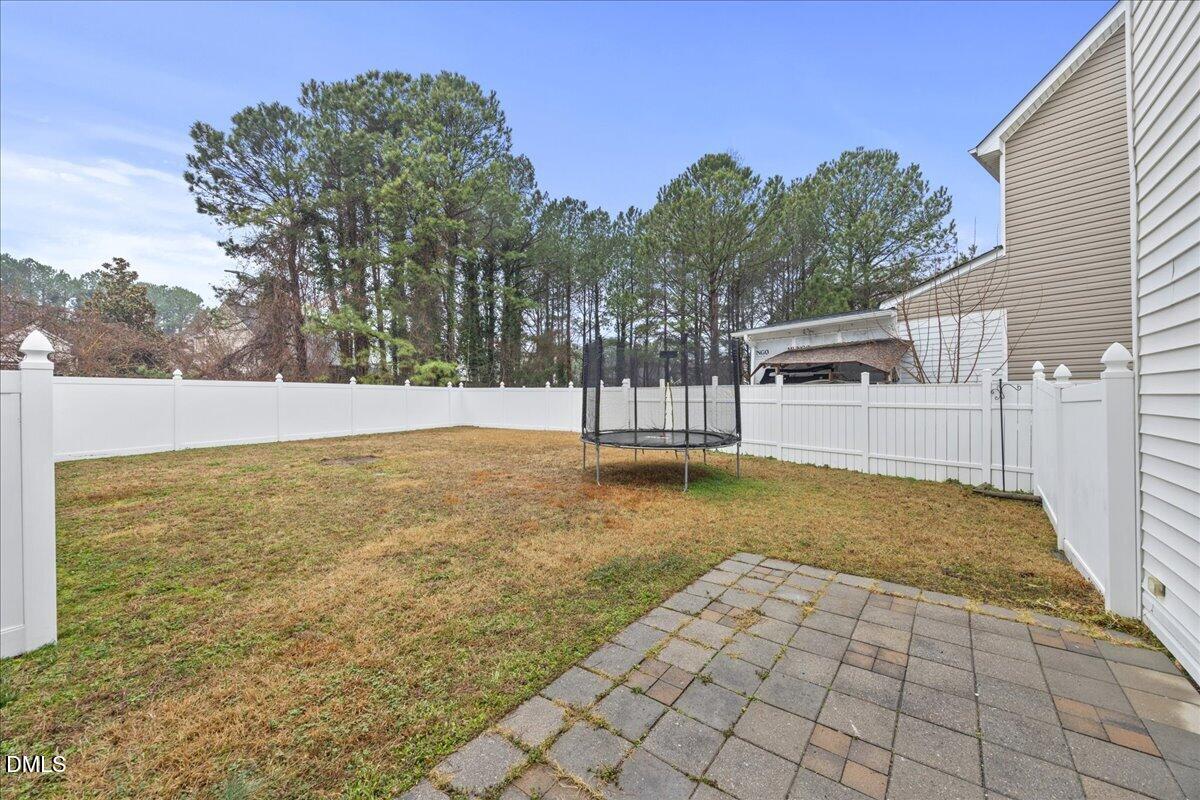 3831 Pin Oak Road Raleigh, NC 27604 - Photo 25 of 28 a view of back yard with basketball court
