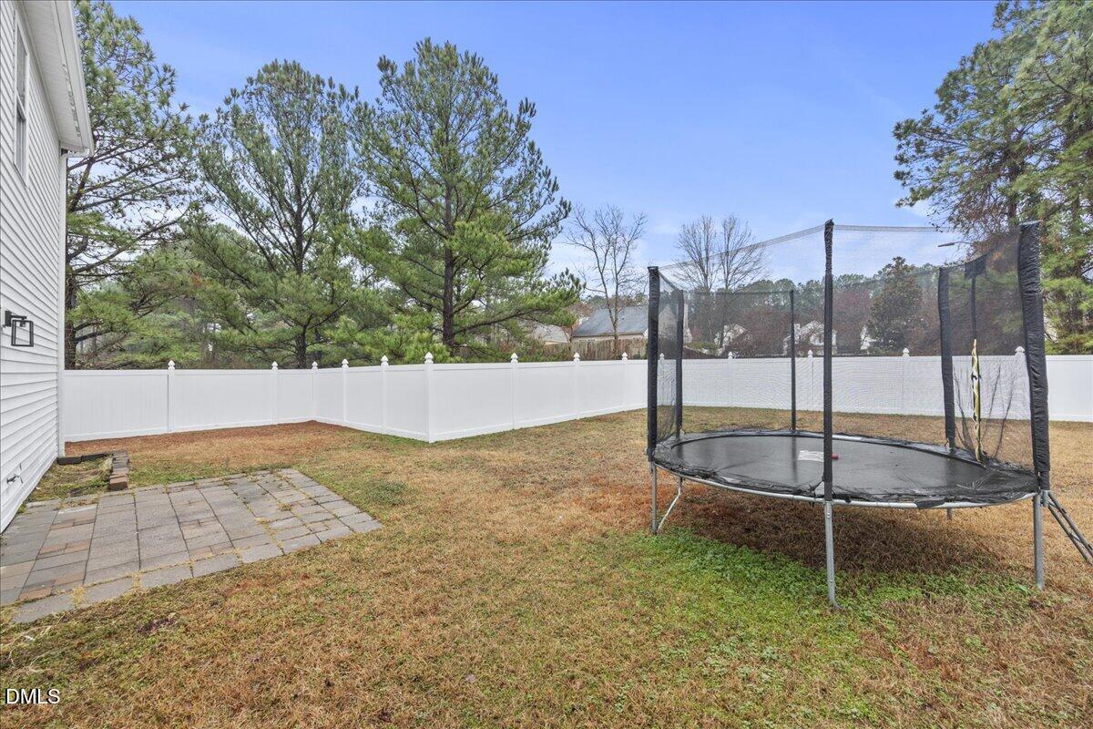 3831 Pin Oak Road Raleigh, NC 27604 - Photo 26 of 28 a backyard of a house with a slide