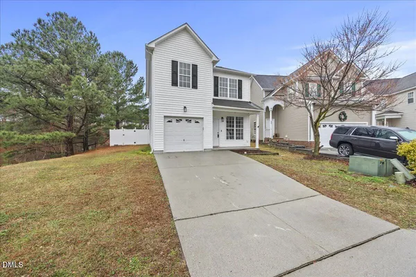 a view of house with yard