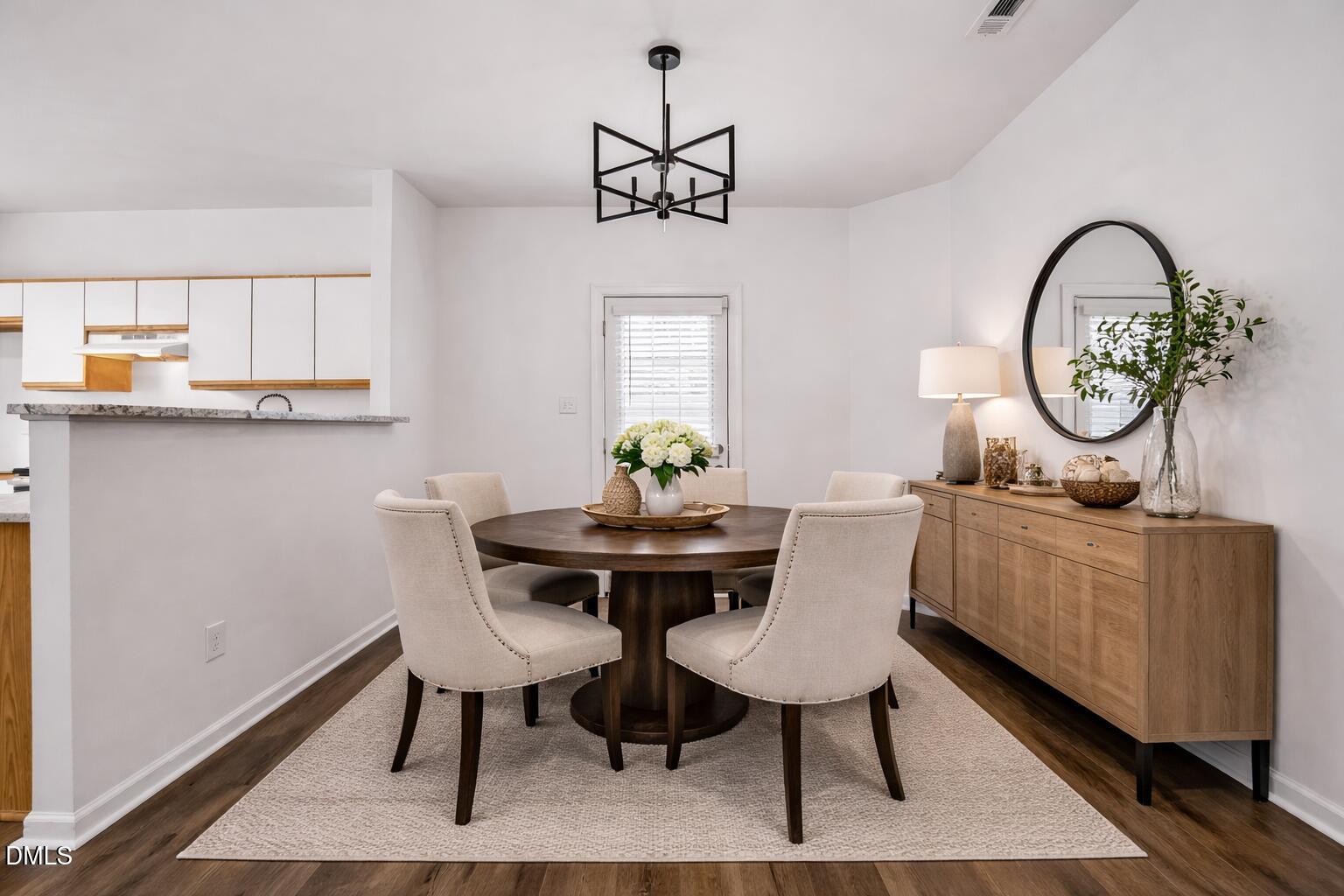 3831 Pin Oak Road Raleigh, NC 27604 - Photo 5 of 28 a view of a dining room with furniture window and wooden floor