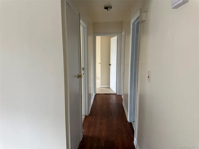 a view of a bathroom from a hallway