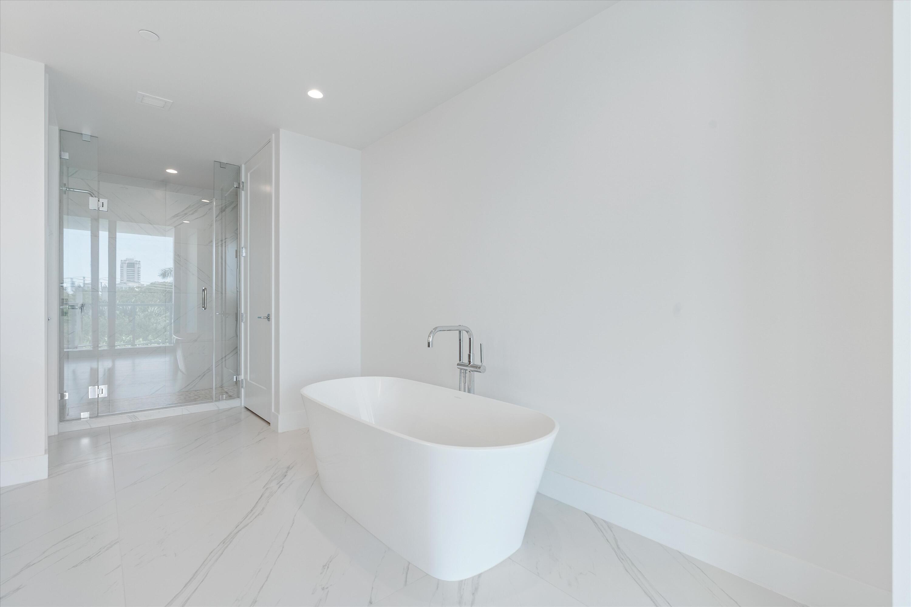 495 East Royal Palm Road, Unit 402 Boca Raton, FL 33432 - Photo 26 of 72 a bathroom with a bathtub and shower