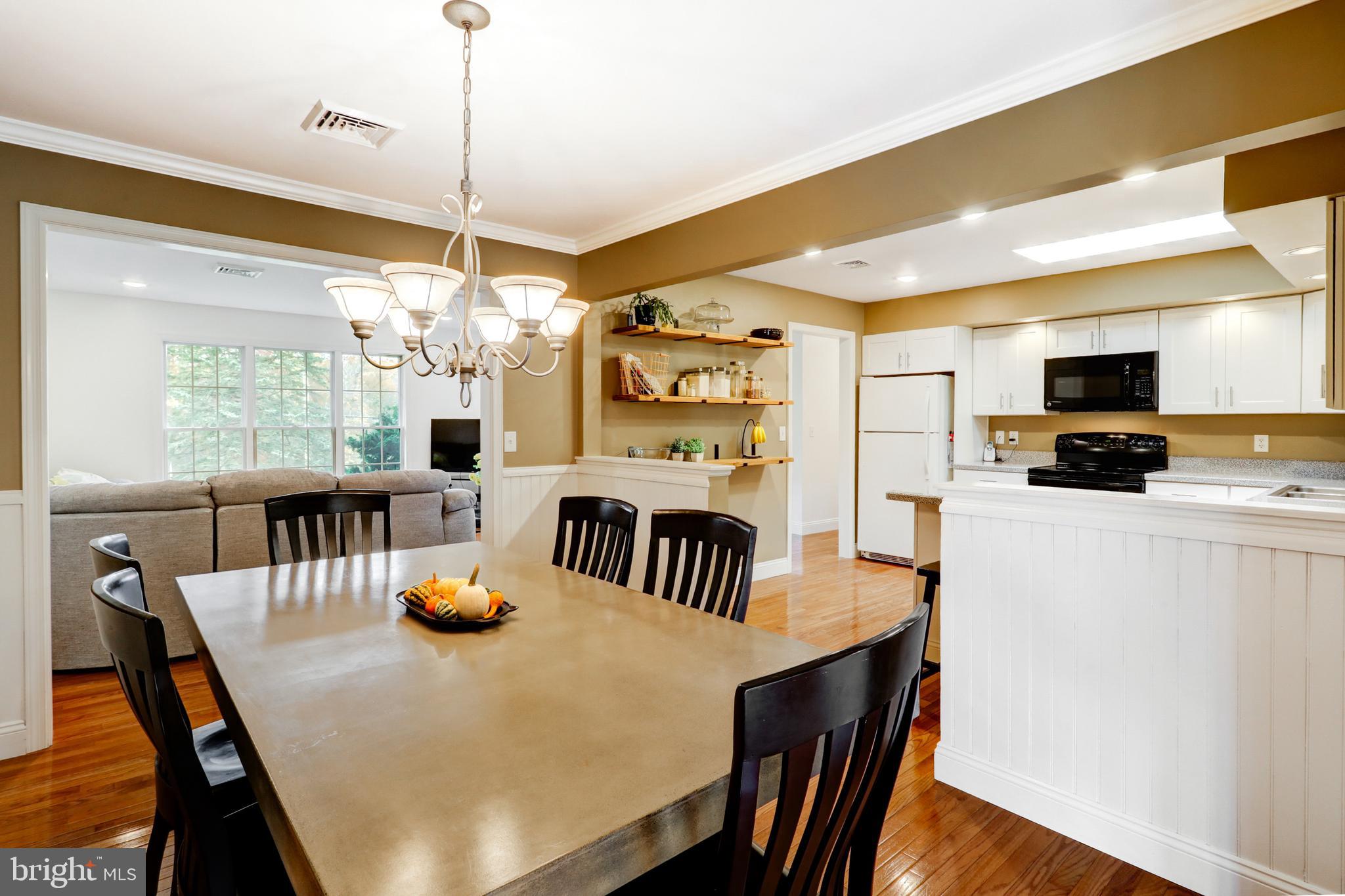 2771 Camp Road Manheim, PA 17545 - Photo 14 of 45 a view of a dining room with furniture window and wooden floor