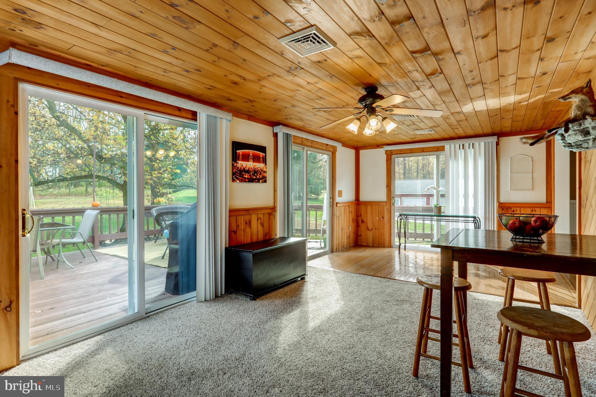 2771 Camp Road Manheim, PA 17545 - Photo 16 of 45 a living room with furniture and a floor to ceiling window