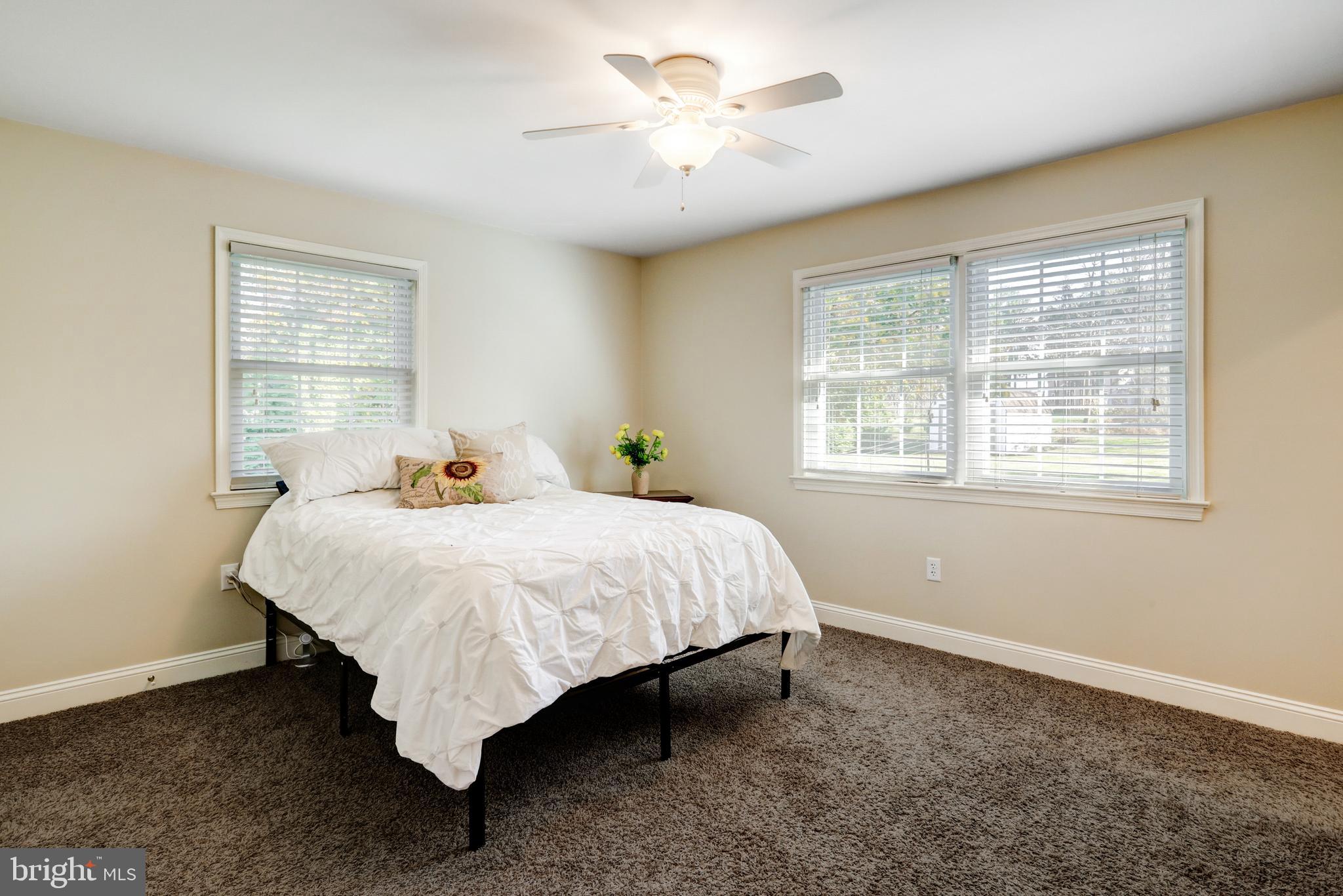 2771 Camp Road Manheim, PA 17545 - Photo 19 of 45 a bed sitting in a bedroom next to a window