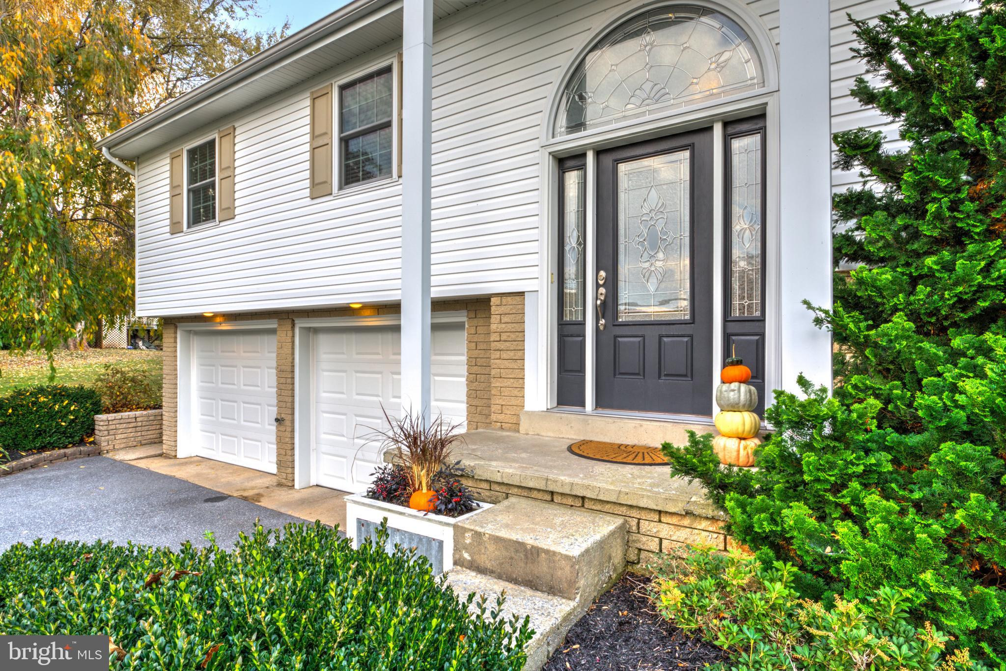 2771 Camp Road Manheim, PA 17545 - Photo 4 of 45 a front view of a house with garden