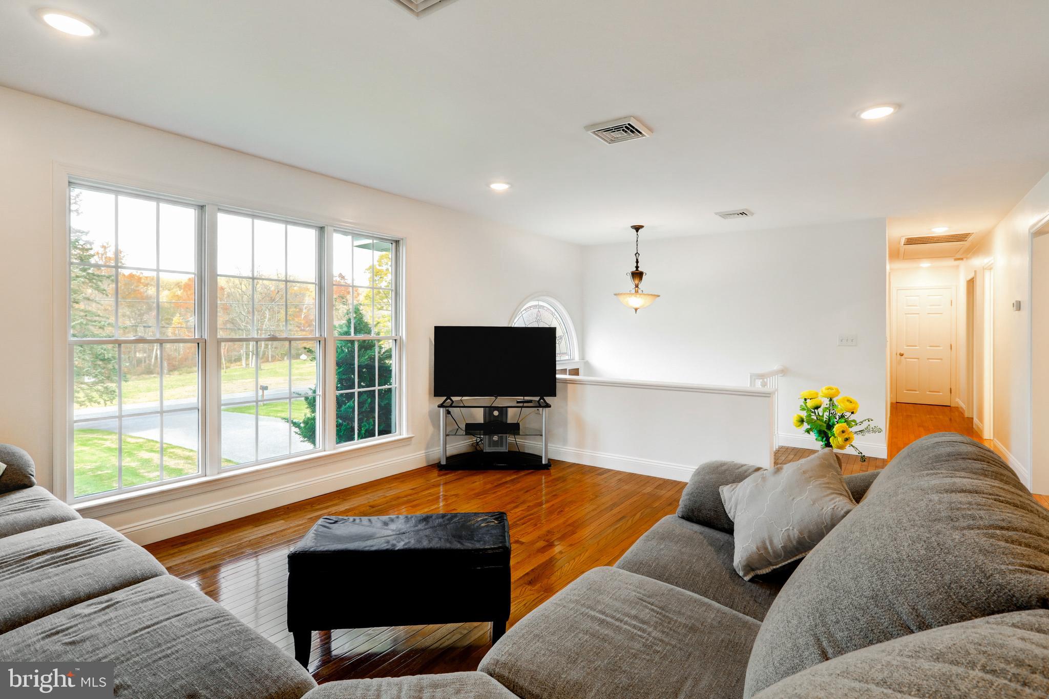 2771 Camp Road Manheim, PA 17545 - Photo 6 of 45 a living room with furniture and a flat screen tv
