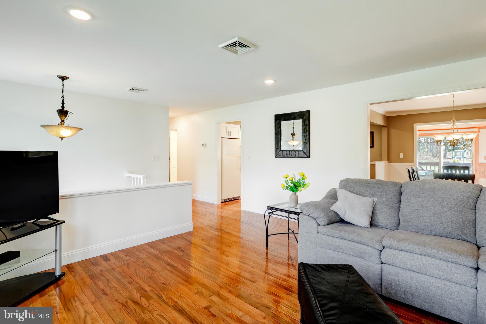 2771 Camp Road Manheim, PA 17545 - Photo 8 of 45 a living room with furniture and a flat screen tv