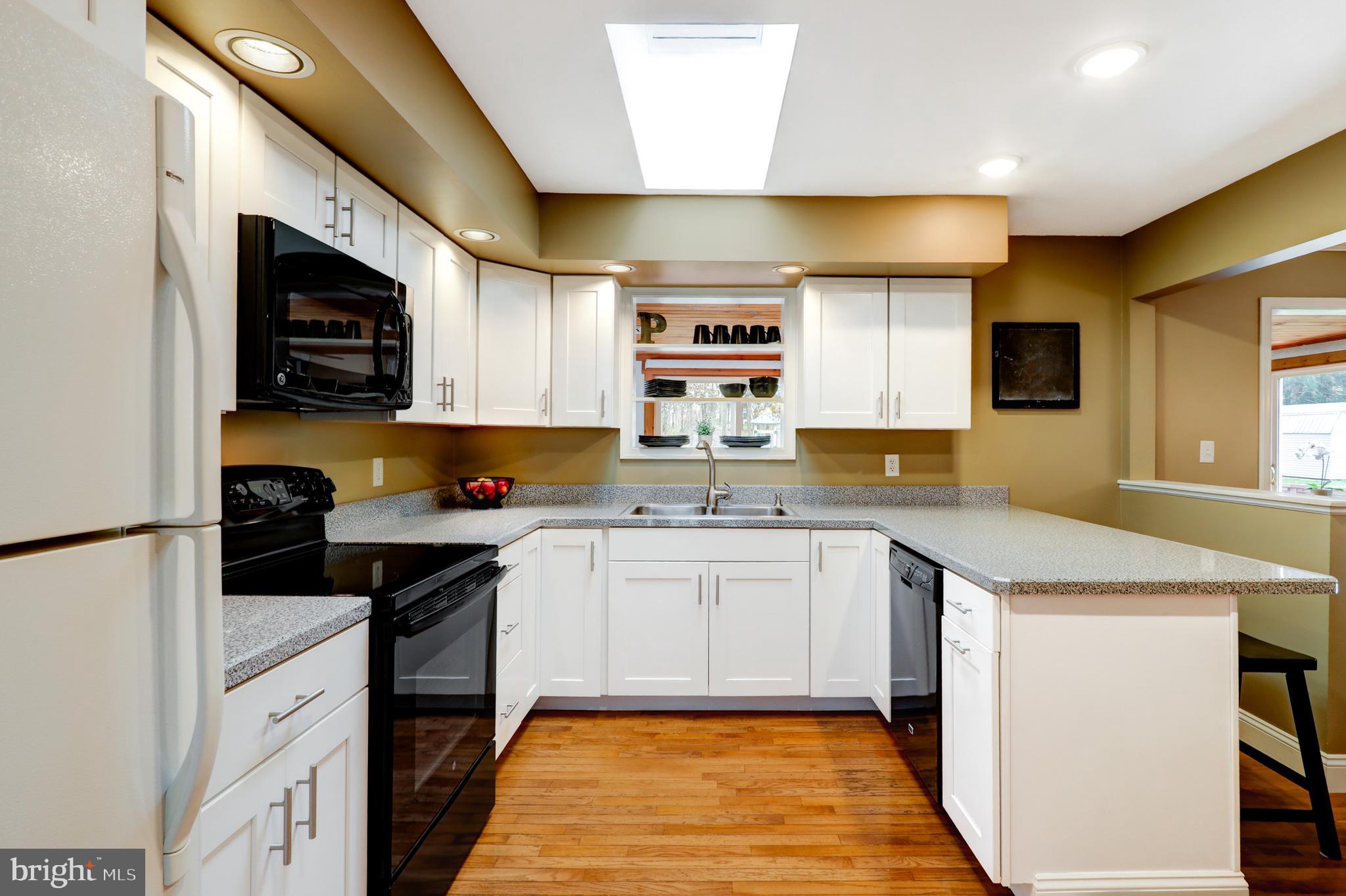 2771 Camp Road Manheim, PA 17545 - Photo 10 of 45 a kitchen with stainless steel appliances granite countertop a sink and a stove