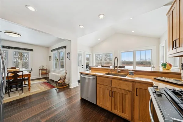 a kitchen with a sink stove and cabinets