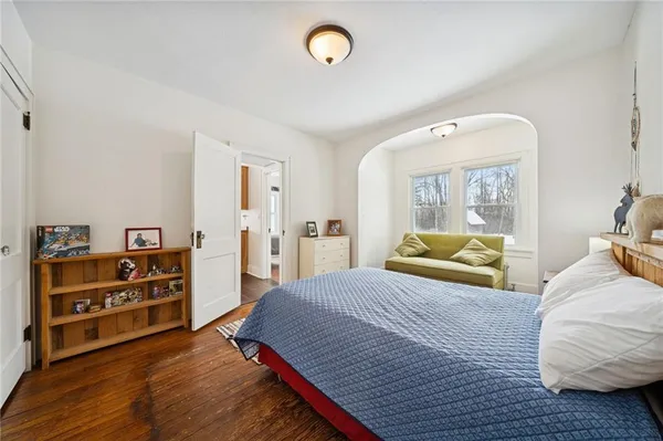 a bedroom with a bed and a dresser