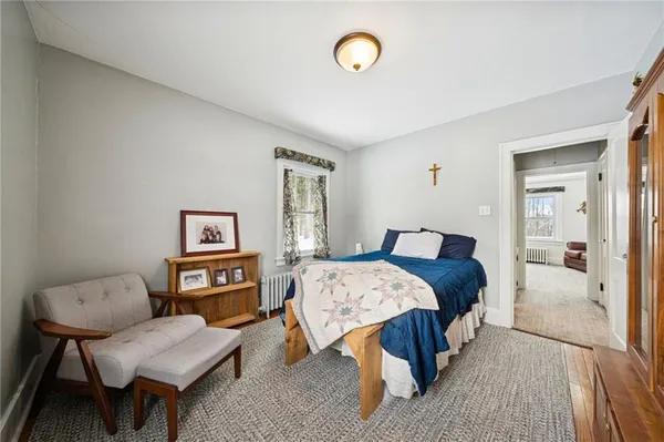 a bedroom with a bed and a table in it