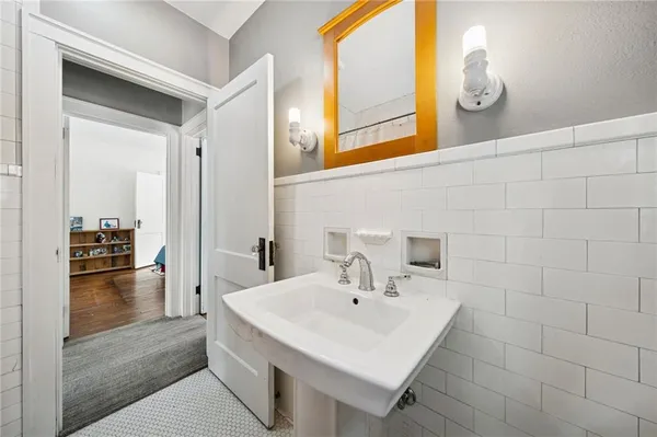 a bathroom with a sink and a mirror