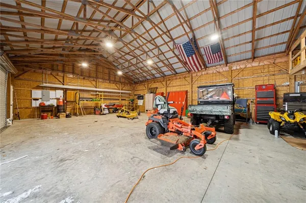 a view of a garage with parked cars