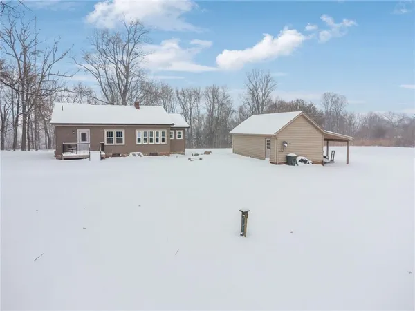 a view of house with snow in front of house