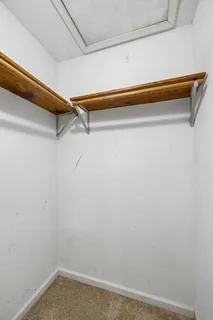 a view of a room with racks on the wall