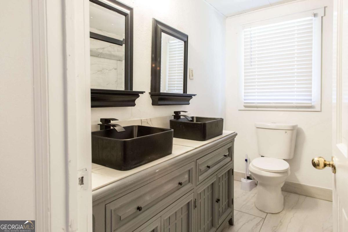 1329 Gorman Road Waycross, GA 31503 - Photo 19 of 23 a view of a bathroom with a sink and a toilet
