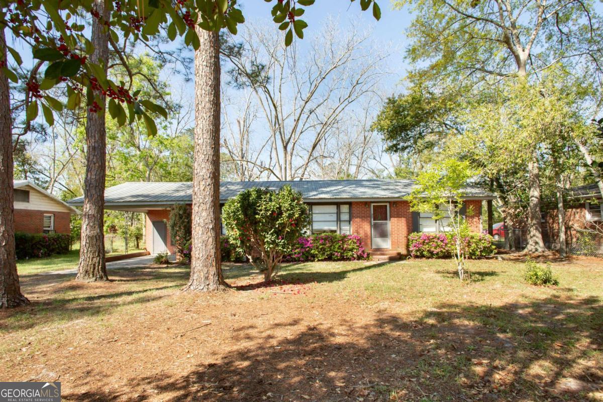 1329 Gorman Road Waycross, GA 31503 - Photo 2 of 23 a view of a house with a yard covered in snow