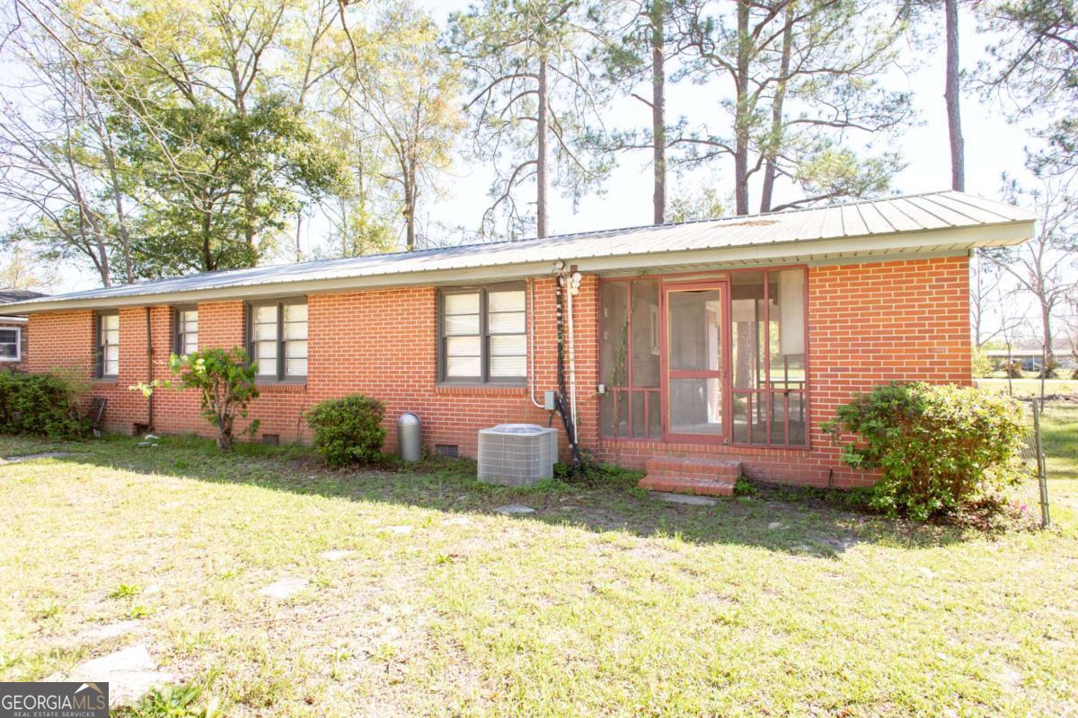 1329 Gorman Road Waycross, GA 31503 - Photo 23 of 23 a front view of a house with garden