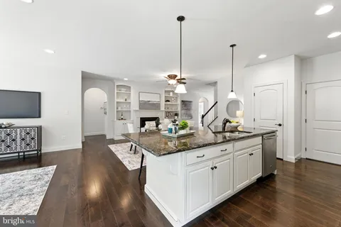 a view of a kitchen counter space and wooden floor