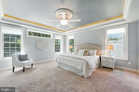 a bed room with a bed and a chair