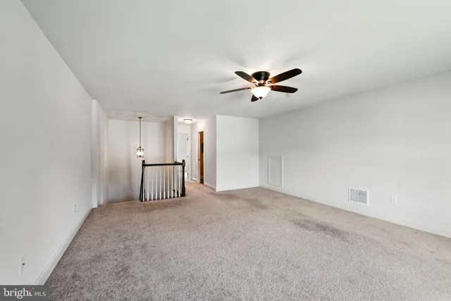 a view of a livingroom with a ceiling fan