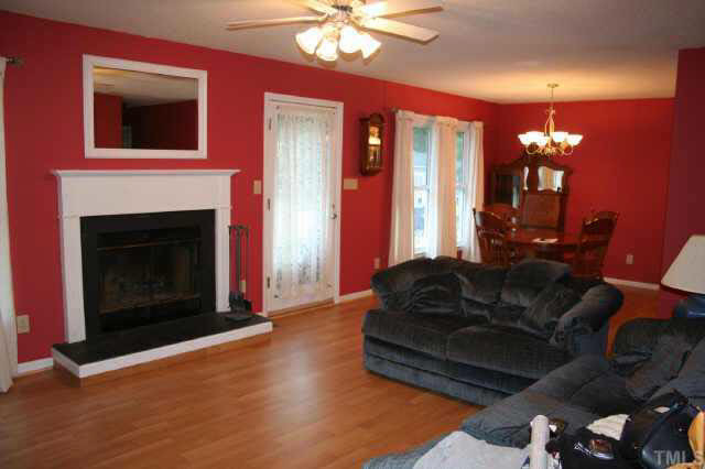 6004 Shadow Moss Circle Raleigh, NC 27603 - Photo 2 of 9 Open living room with new laminate flrg and cozy wood-burning fplc. Other